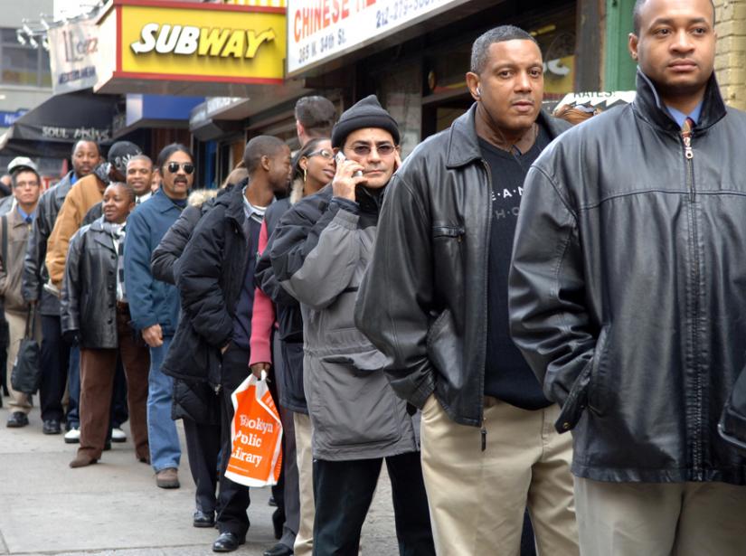 Applicants line up at a job fair at the New Yorker Hotel in January 2007