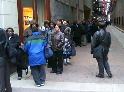 Hundreds of people stand in line to apply for jobs at the new Hotel Wit in Chicago