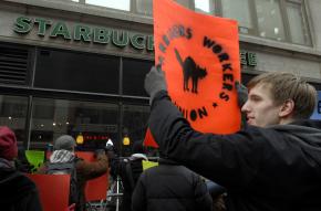 Starbucks workers and their supporters protest outside a New York City store