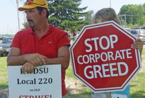 Strikers on the picket line at the Mott's plant in Williamson, N.Y.