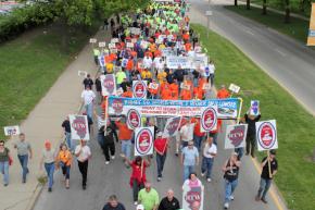 Labor activists and supporters un-welcome Mitch Daniels during his visit to Champaign, Illinois