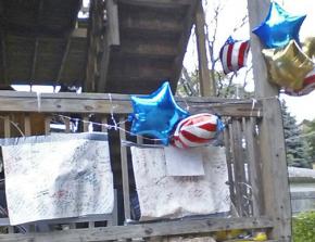 A memorial for Roshad McIntosh on the back deck of the building near where he was shot