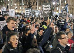 Antiwar protesters gather outside parliament to oppose Cameron's plan for more war