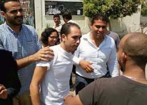 Malek Adly (center) after his release from prison