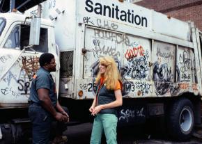 Artist Mierle Laderman Ukeles speaks with a sanitation worker in New York City