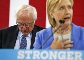Bernie Sanders waits to endorse Hillary Clinton at a New Hampshire rally