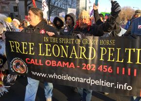 Leonard Peltier's oldest son, Chauncy Peltier (left) marches alongside Navajo filmmaker Norman Patrick Brown in Washington, D.C.