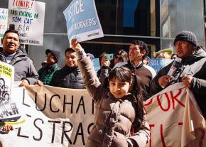 Workers and family members rally at the Tom Cat Bakery in New York City