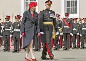 British Prime Minister Theresa May (left) inspects officer cadets at the Royal Military Academy