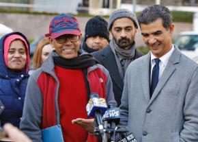 Riaz Talukder (second from left) celebrates with family and supporters after leaving ICE headquarters