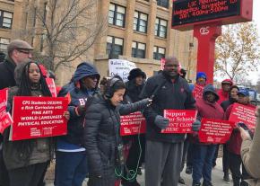 Parents, community and staff protest the planned closure of Harper High School on the South Side