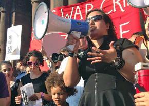 Siham Byah speaks at a rally for Palestinian rights in Boston