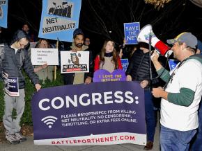Defenders of net neutrality protest FCC Chair Ajit Pai and telecom lobbyists in Washington, D.C.